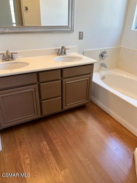 1715 Empty Saddle Road Simi Valley, CA 93063 - Photo 17 of 20 a bathroom with a sink and a bathtub