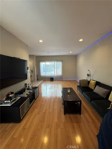 a kitchen with stainless steel appliances granite countertop a refrigerator and a stove