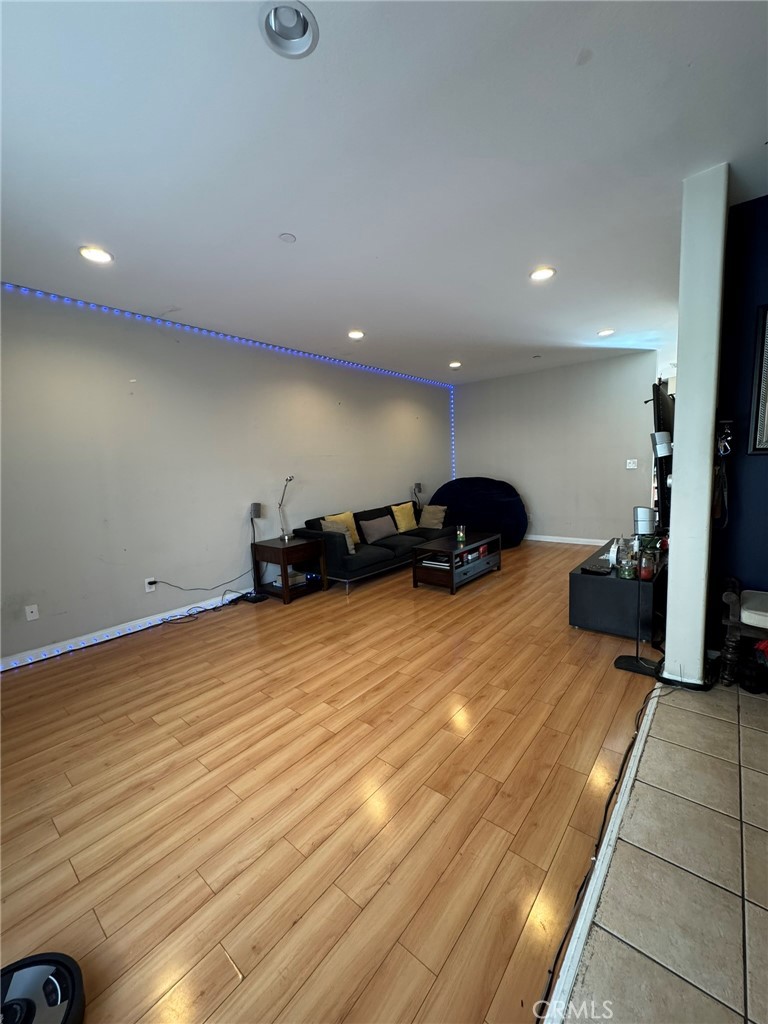 12375 Osborne Place, Unit 7 Pacoima, CA 91331 - Photo 8 of 30 a view of a room with furniture and a ceiling fan