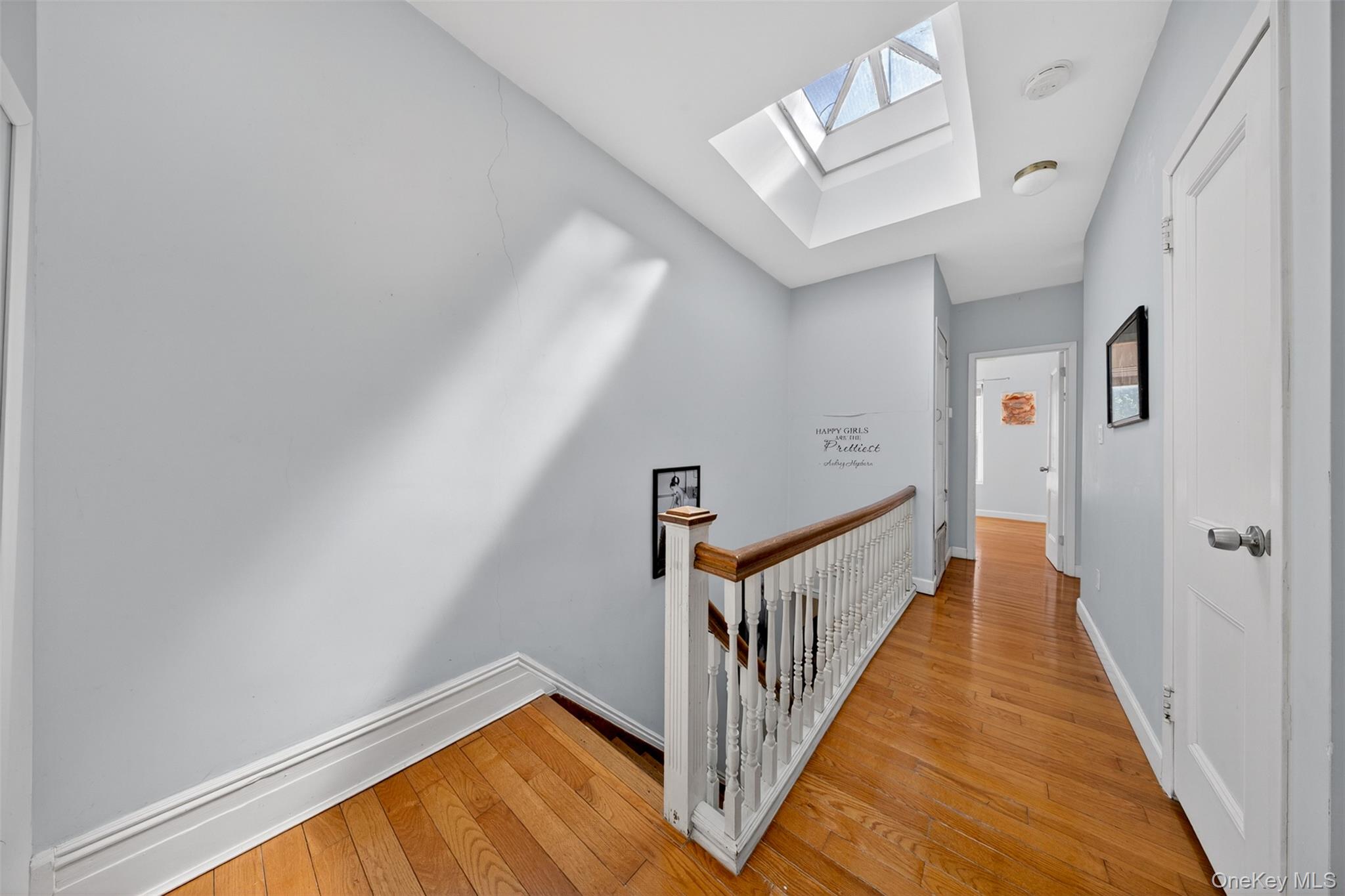 88-42 87th Street Queens, NY 11421 - Photo 15 of 33 a view of a hallway with wooden floor and entryway