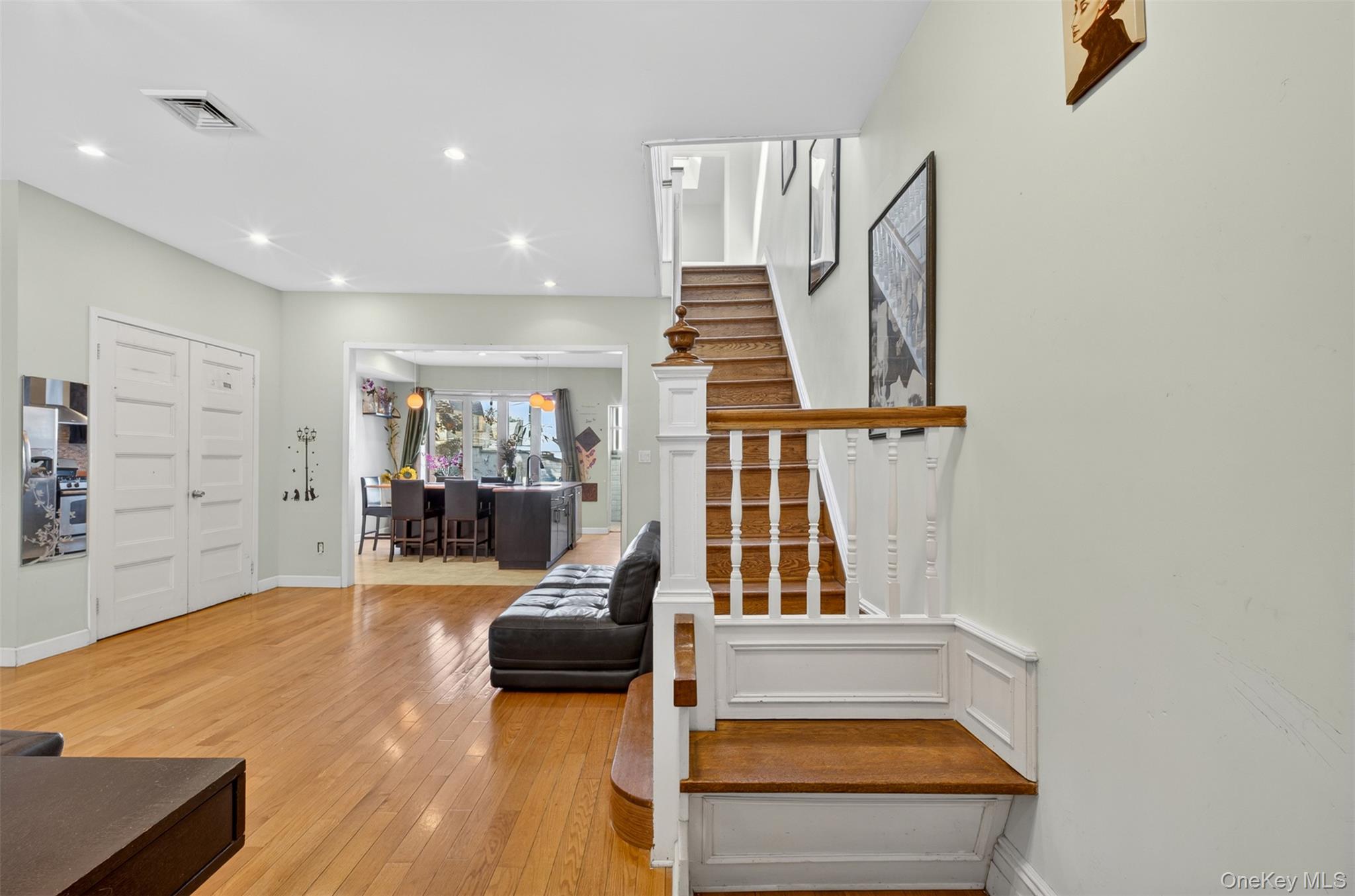 88-42 87th Street Queens, NY 11421 - Photo 16 of 33 a living room with furniture and a wooden floor