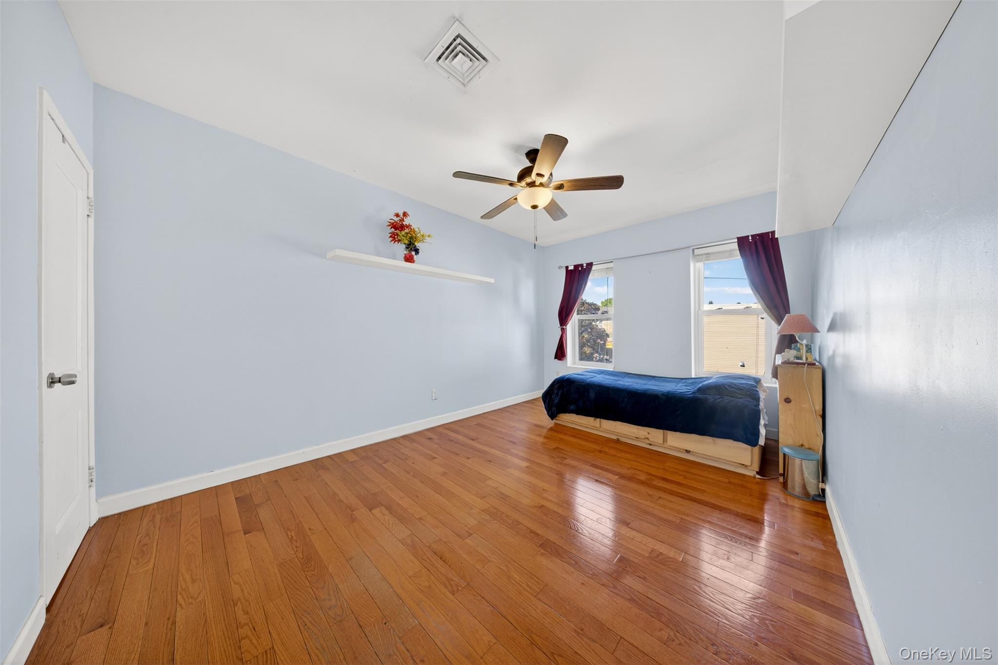 88-42 87th Street Queens, NY 11421 - Photo 17 of 33 a view of entryway and hall with wooden floor