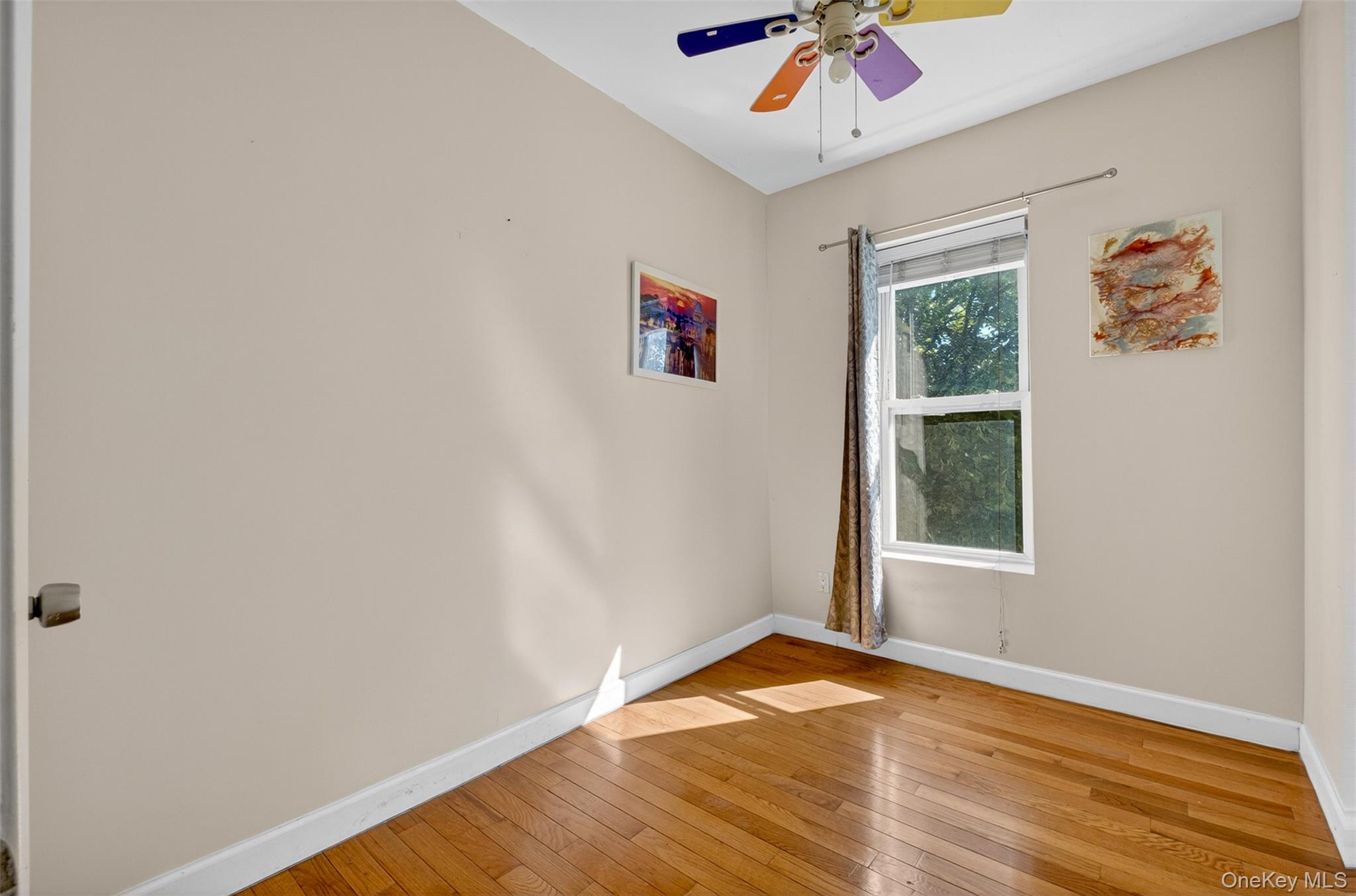 88-42 87th Street Queens, NY 11421 - Photo 19 of 33 an empty room with a workspace