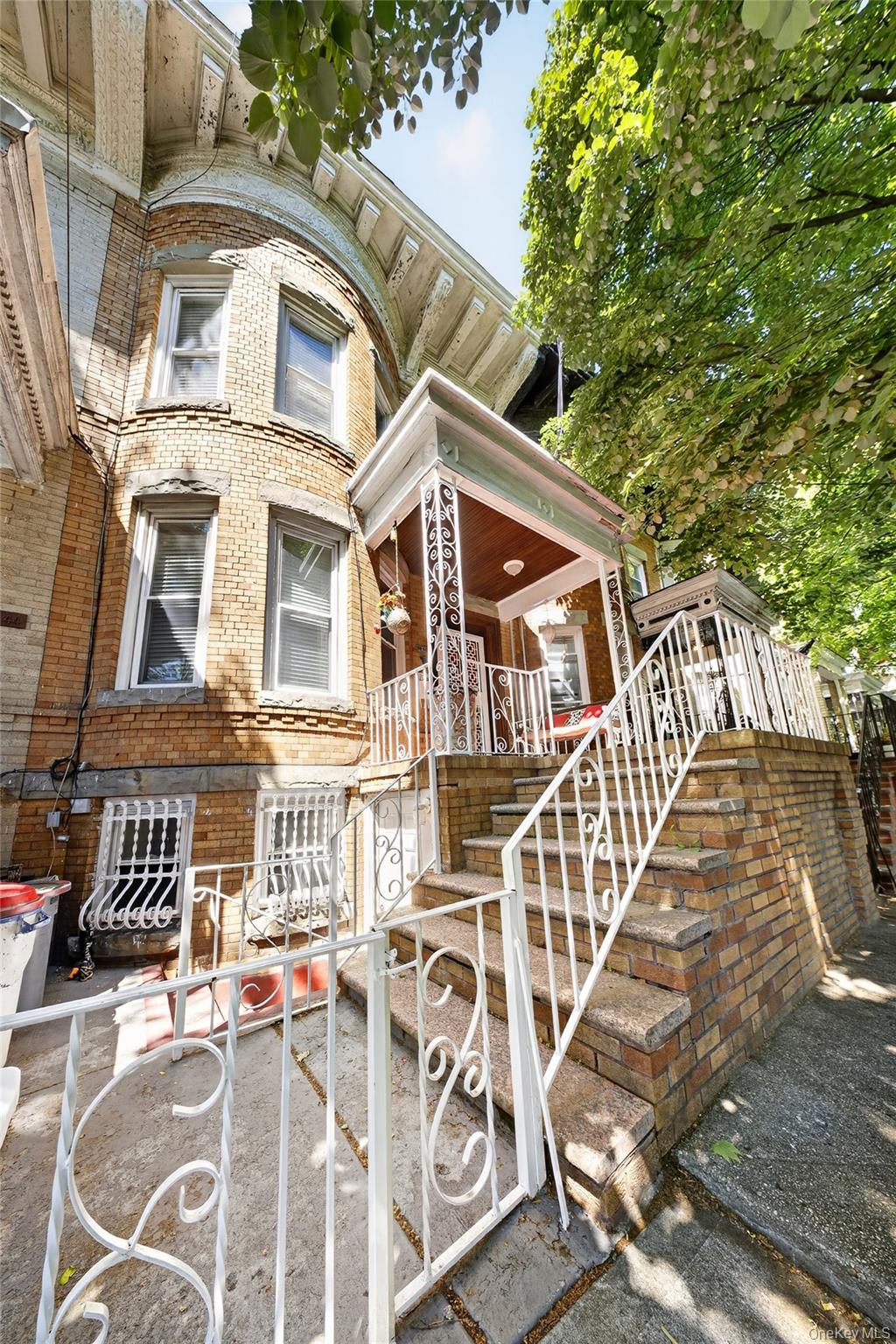 88-42 87th Street Queens, NY 11421 - Photo 2 of 33 front view of a building