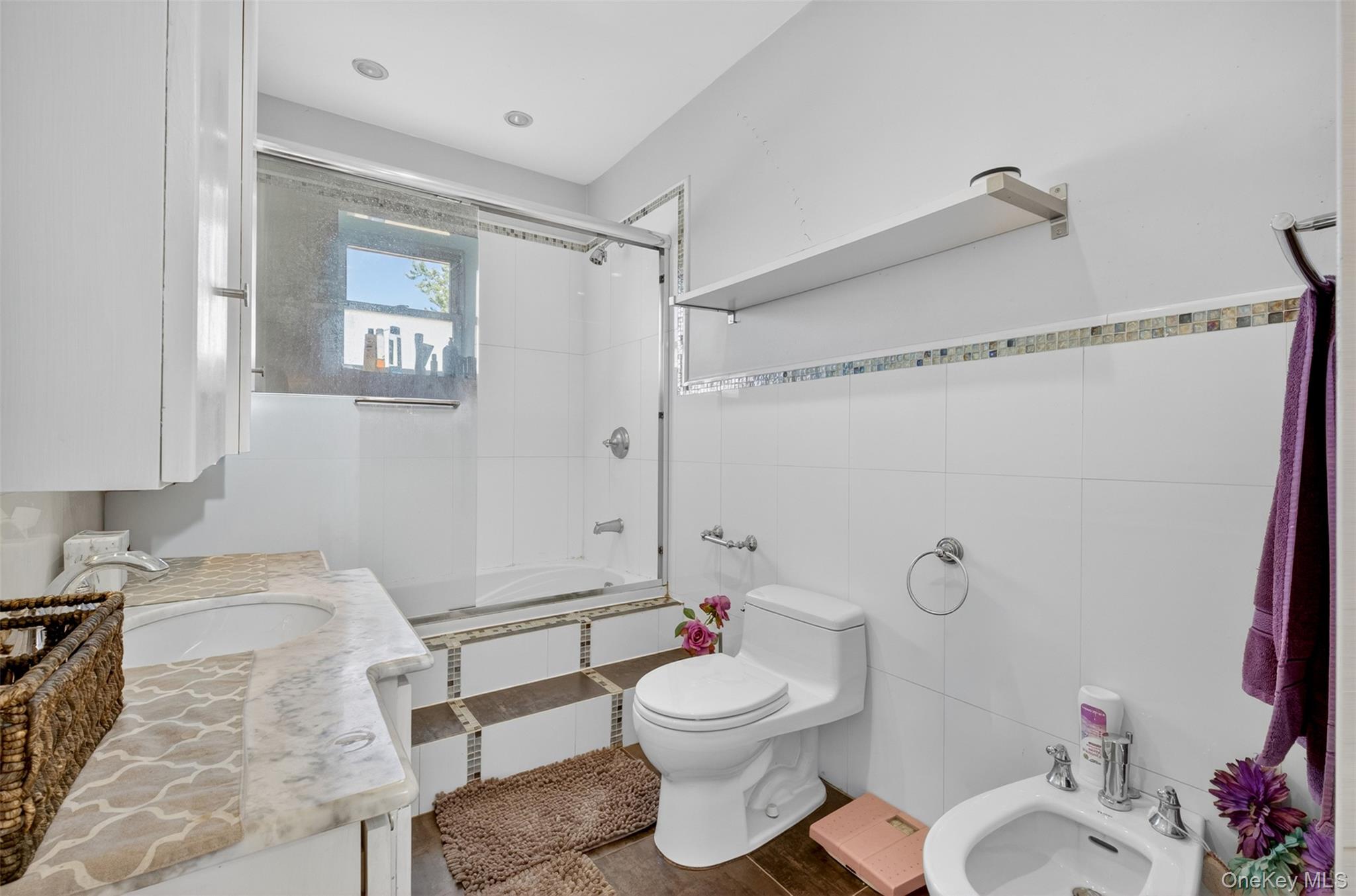 88-42 87th Street Queens, NY 11421 - Photo 21 of 33 a bathroom with a granite countertop toilet sink and shower