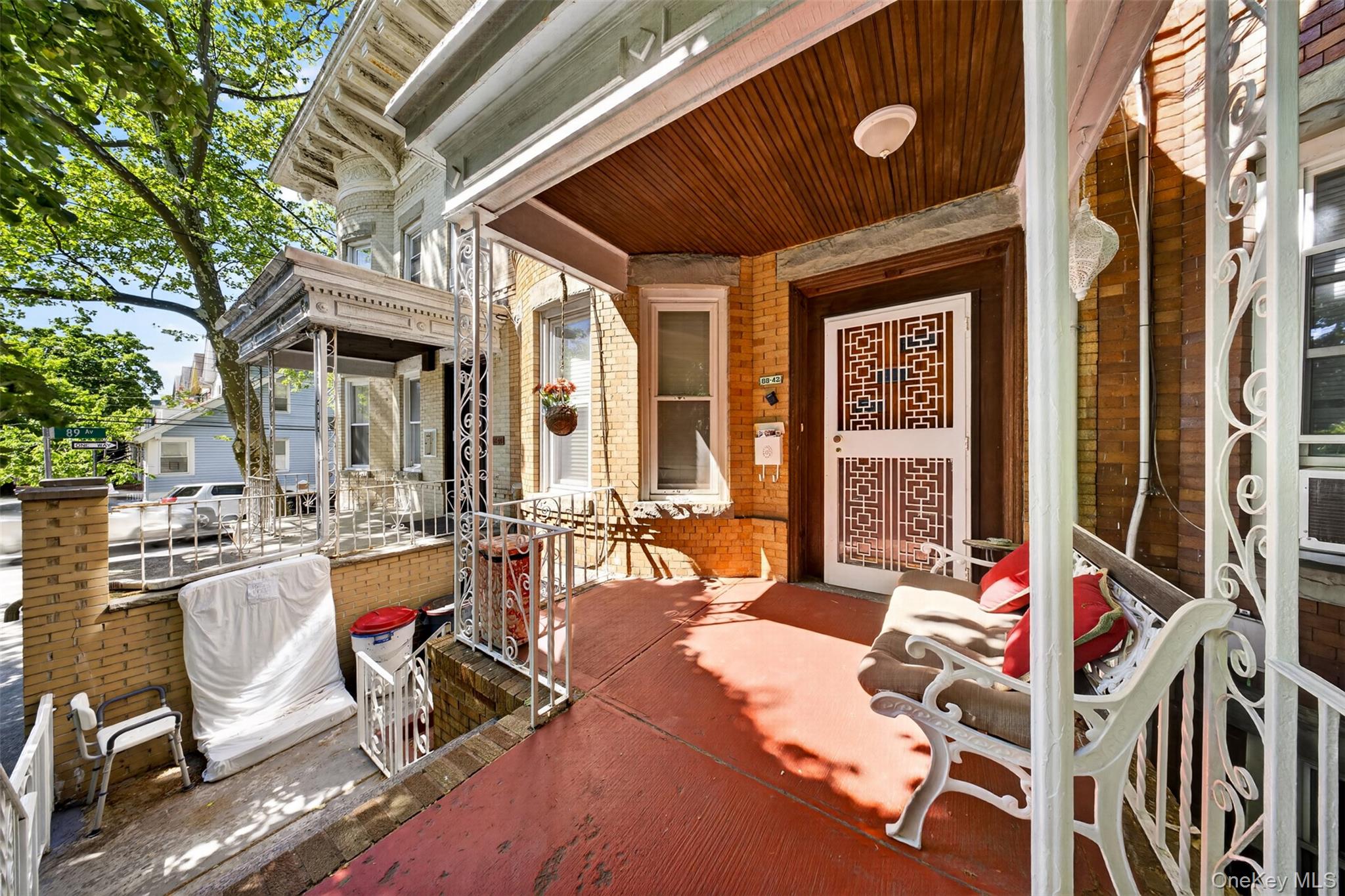 88-42 87th Street Queens, NY 11421 - Photo 3 of 33 a building outdoor space with patio furniture