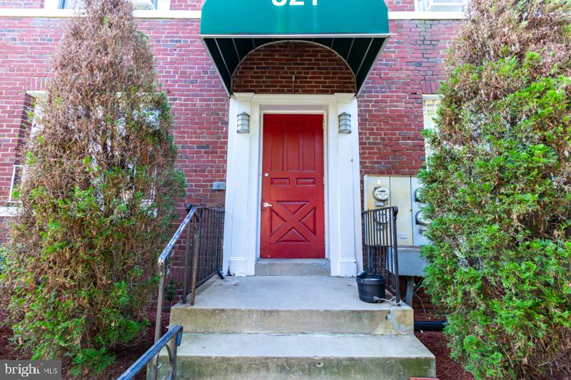 321 Adams Street Northeast Washington, DC 20002 - Photo 4 of 5 Charming entrance with vibrant red door.