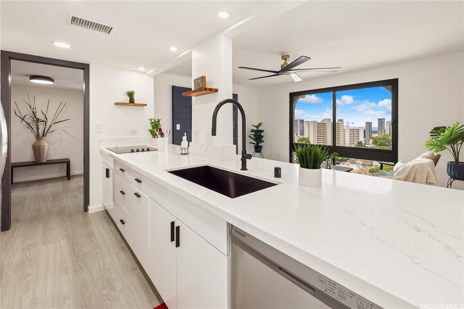 a kitchen with a sink and a refrigerator
