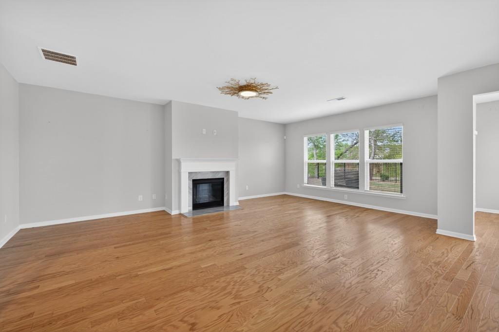 7277 Maple Brook Lane Flowery Branch, GA 30542 - Photo 17 of 57 a view of an empty room with glass door and a window