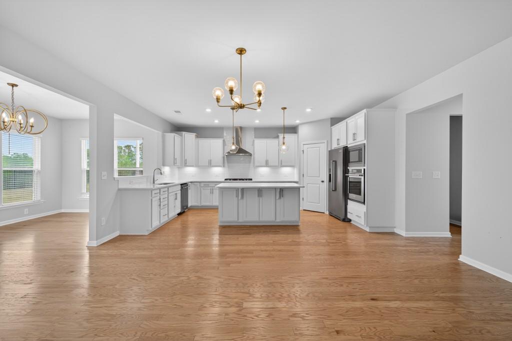 7277 Maple Brook Lane Flowery Branch, GA 30542 - Photo 20 of 57 a view of kitchen with refrigerator and cabinets