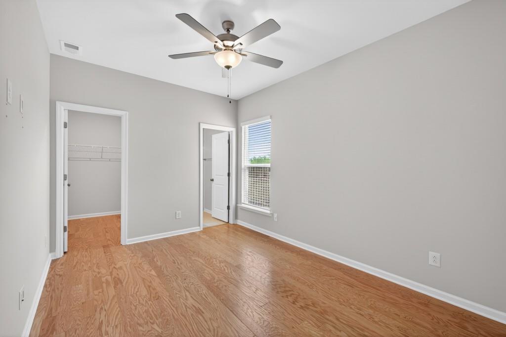 7277 Maple Brook Lane Flowery Branch, GA 30542 - Photo 29 of 57 a view of an empty room with a window