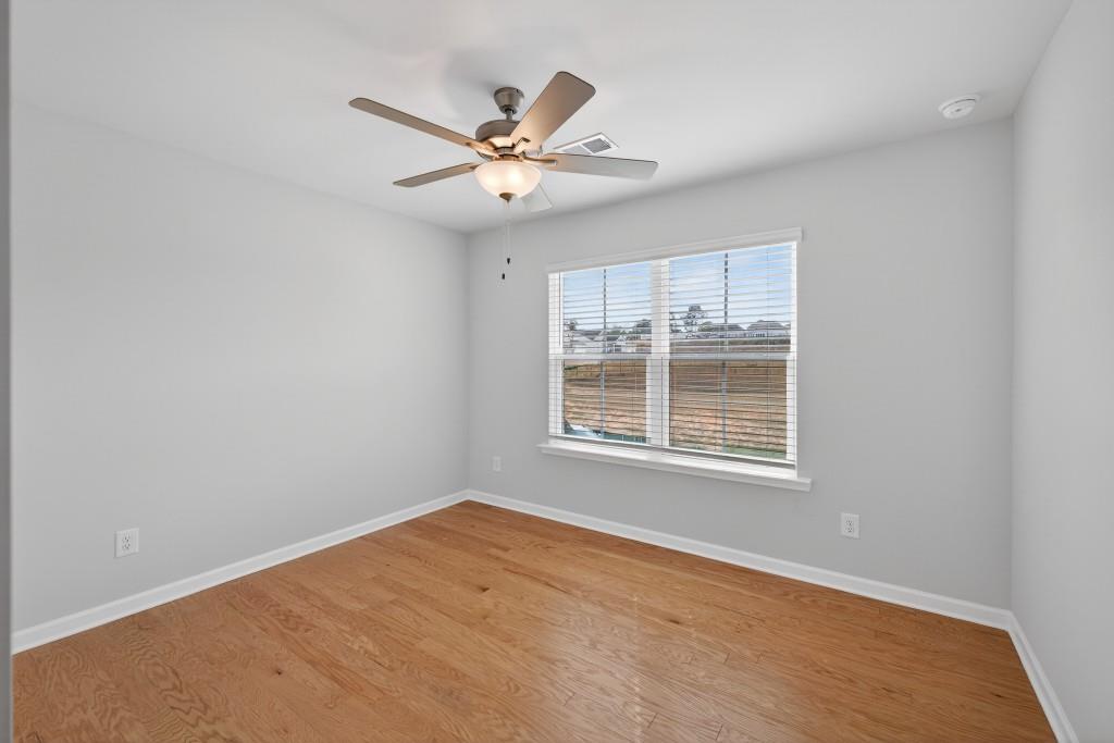 7277 Maple Brook Lane Flowery Branch, GA 30542 - Photo 35 of 57 a view of an empty room with a window