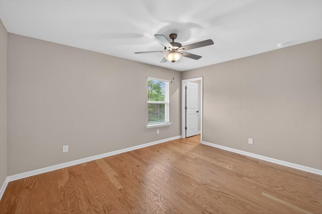 7277 Maple Brook Lane Flowery Branch, GA 30542 - Photo 38 of 57 a view of an empty room with a window