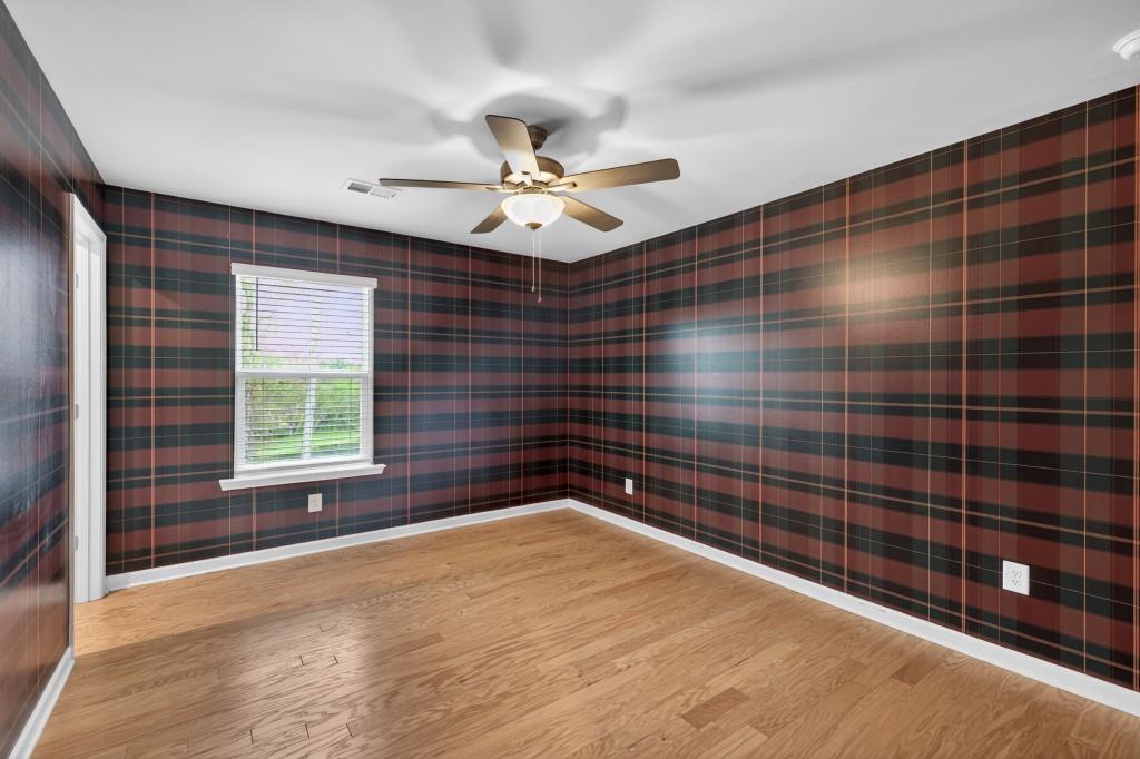 7277 Maple Brook Lane Flowery Branch, GA 30542 - Photo 40 of 57 a view of an empty room and window