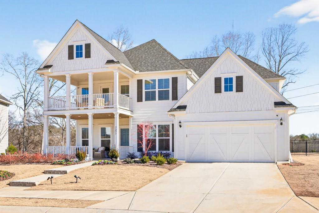 7277 Maple Brook Lane Flowery Branch, GA 30542 - Photo 4 of 57 a front view of a house with a yard