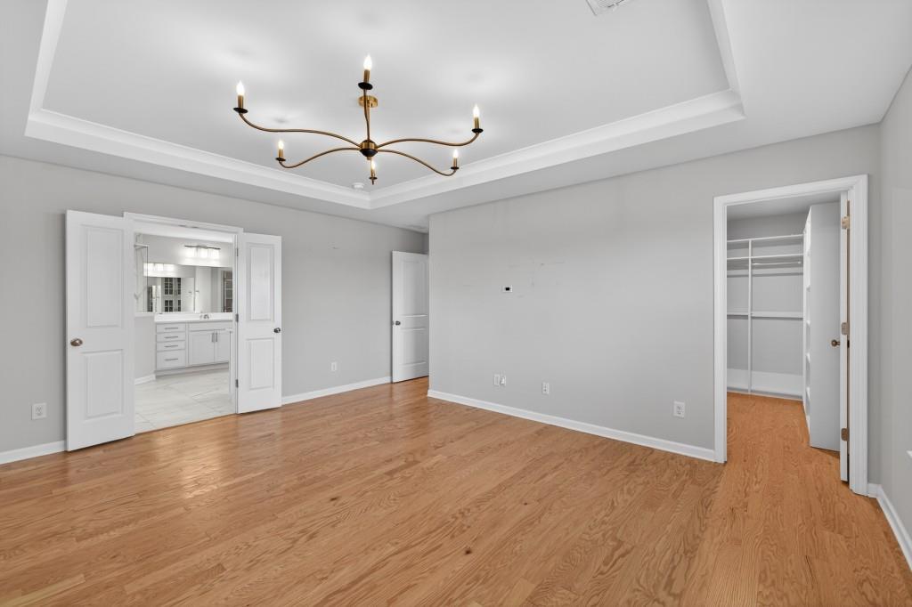7277 Maple Brook Lane Flowery Branch, GA 30542 - Photo 49 of 57 a view of empty room with wooden floor