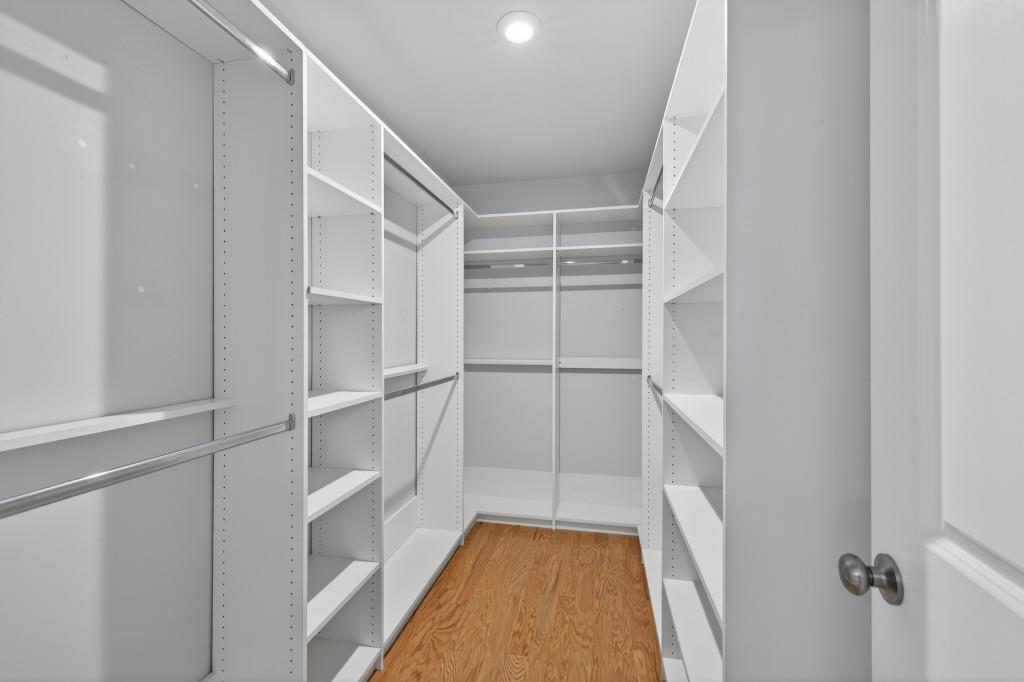 7277 Maple Brook Lane Flowery Branch, GA 30542 - Photo 50 of 57 a view of walk in closet with empty racks