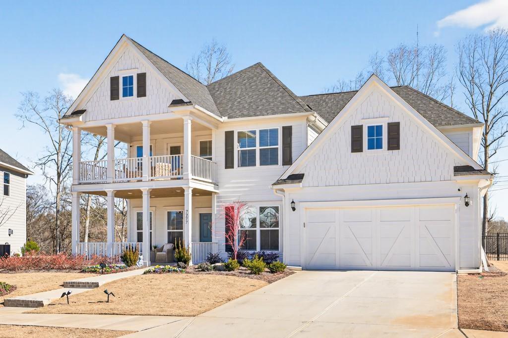 7277 Maple Brook Lane Flowery Branch, GA 30542 - Photo 5 of 57 a view of a white house with large windows