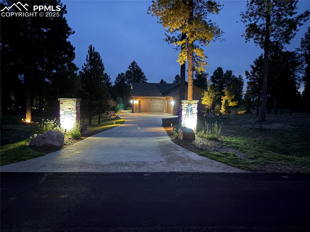 5070 Vessey Road Colorado Springs, CO 80908 - Photo 25 of 43 View of front of house featuring driveway and an attached garage