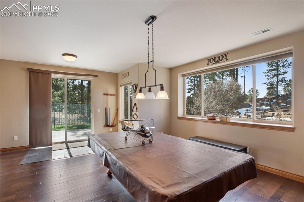 5070 Vessey Road Colorado Springs, CO 80908 - Photo 26 of 49 Recreation room with visible vents, billiards, baseboards, and dark wood-style flooring