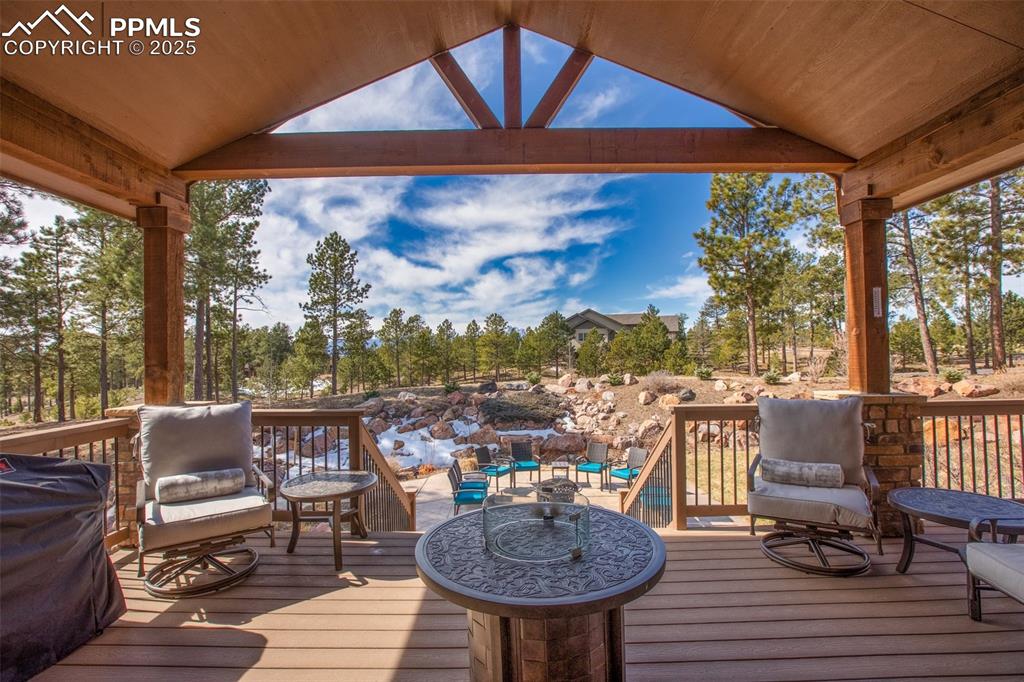 5070 Vessey Road Colorado Springs, CO 80908 - Photo 3 of 49 Wooden terrace featuring an outdoor hangout area