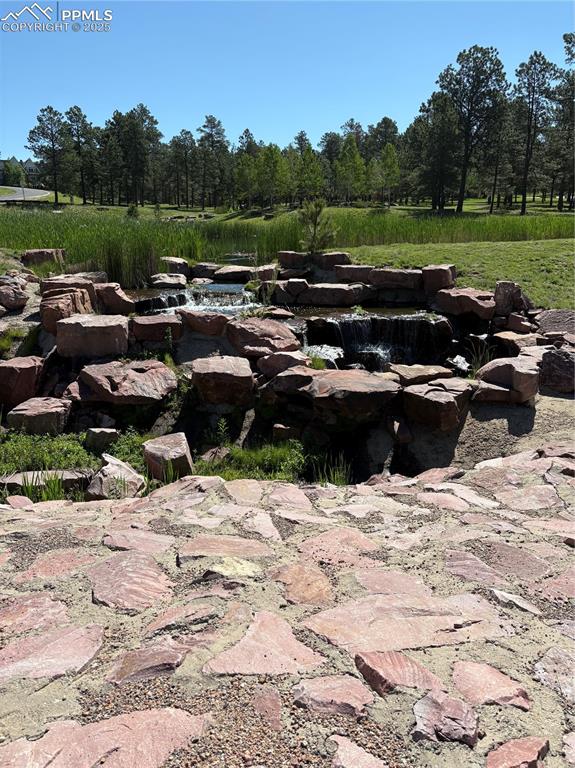 5070 Vessey Road Colorado Springs, CO 80908 - Photo 39 of 49 Peaceful waterfall near the lodge