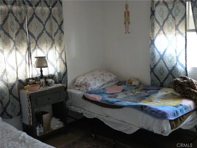 a room with a bed and a mirror