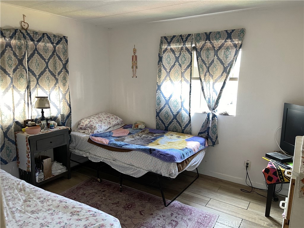 350 East San Jacinto Avenue, Unit 121 Perris, CA 92571 - Photo 23 of 24 a bedroom with bed and a window