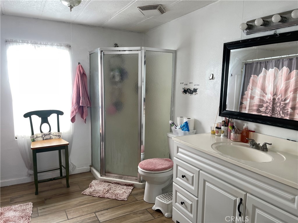 350 East San Jacinto Avenue, Unit 121 Perris, CA 92571 - Photo 24 of 24 a bathroom with a sink toilet and shower