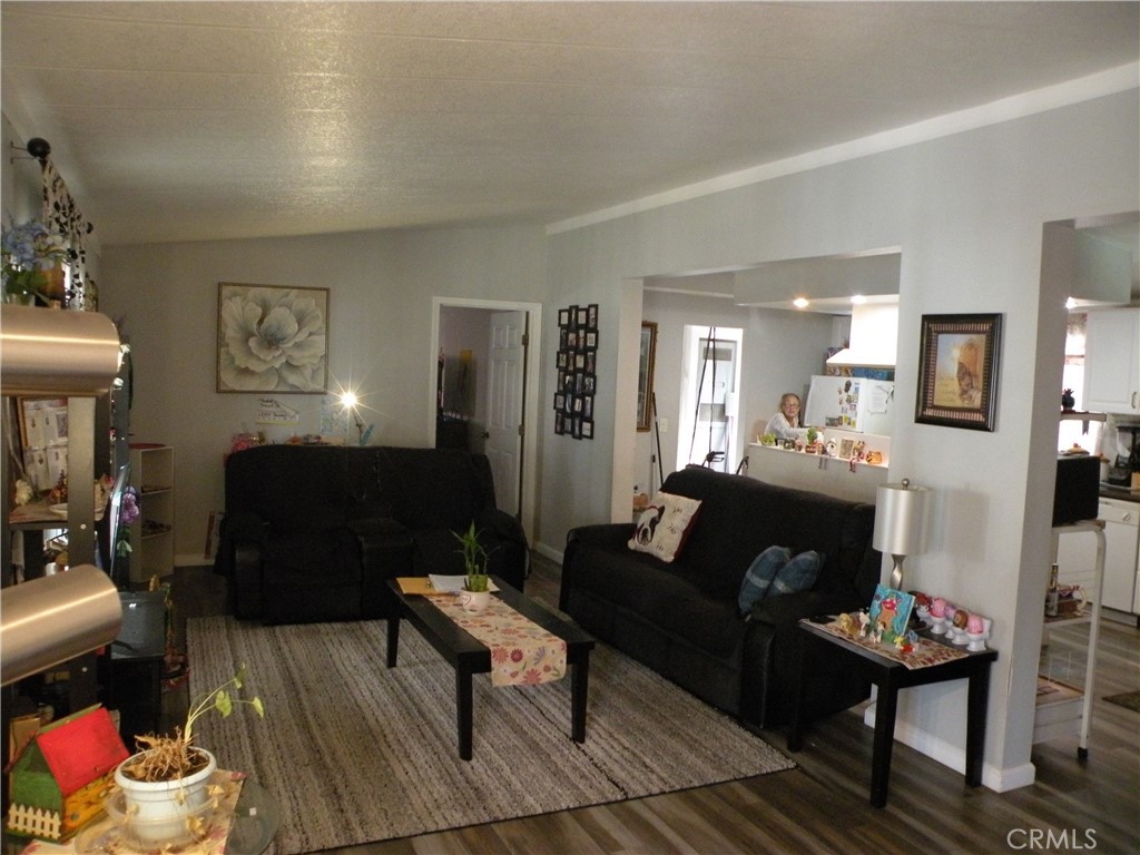 350 East San Jacinto Avenue, Unit 121 Perris, CA 92571 - Photo 4 of 24 a living room with furniture and a wooden floor