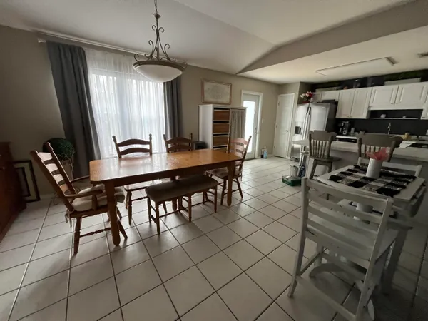 a kitchen with stainless steel appliances a refrigerator sink and microwave