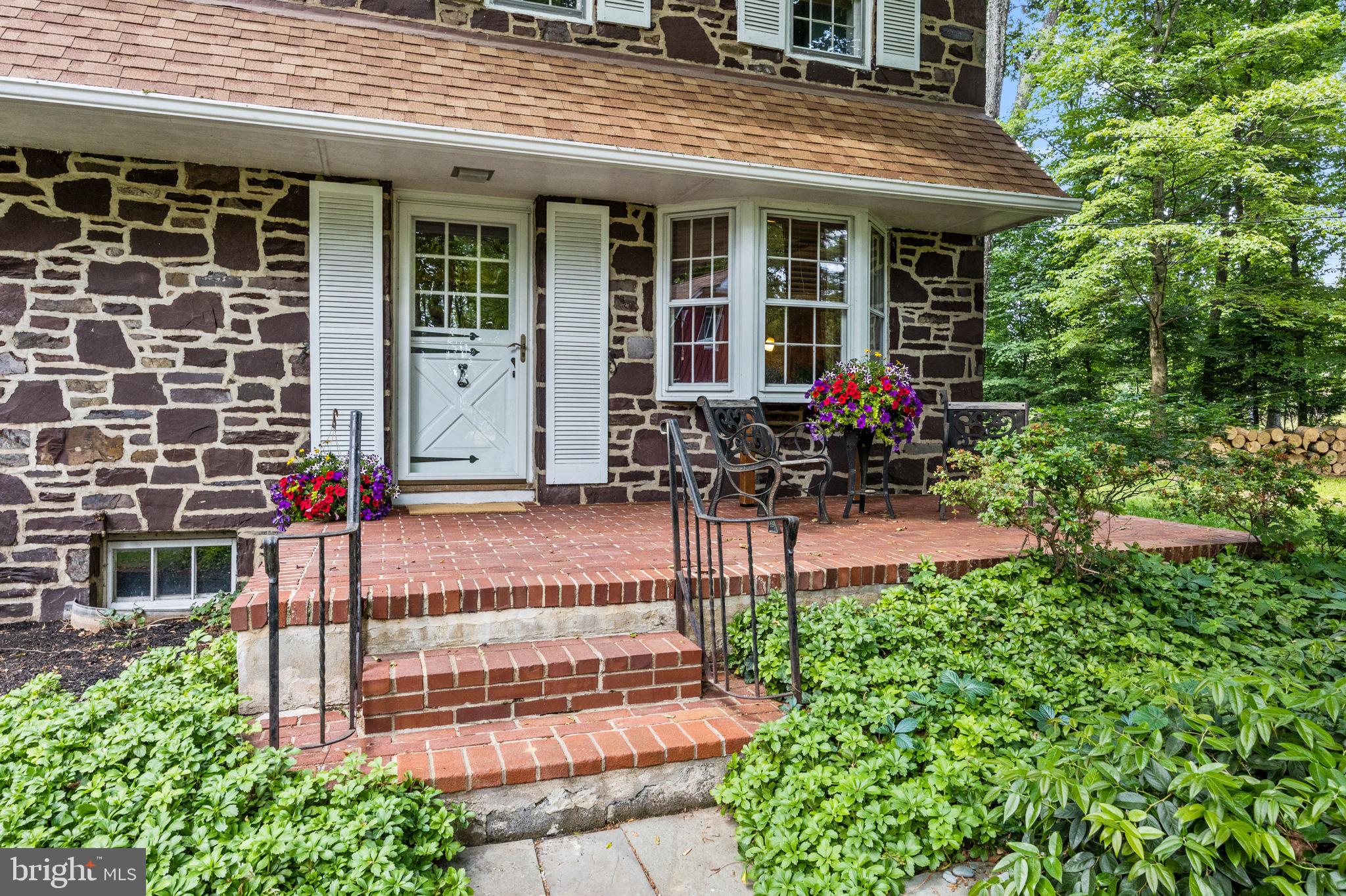 Front brick patio and Entry door to the main house