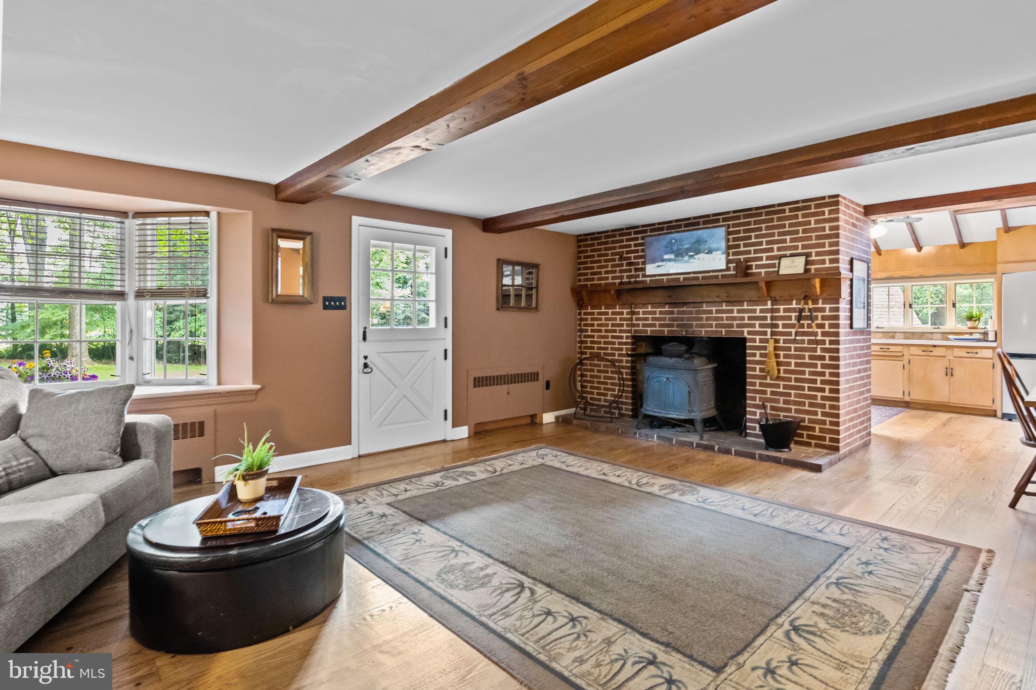 731 Linton Hill Road Newtown, PA 18940 - Photo 8 of 41 Brick fireplace with woodburning stove.