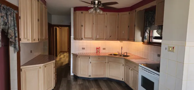 a kitchen with stainless steel appliances a stove and a refrigerator