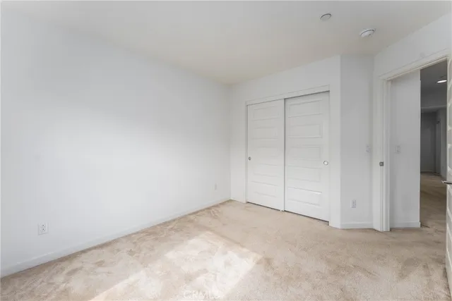 an empty room with closet area