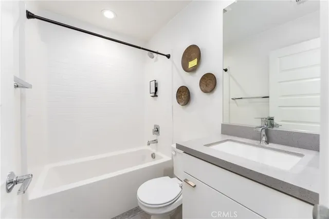 an empty room with a fireplace and window