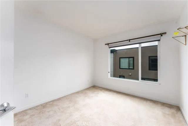 a bathroom with a granite countertop toilet a sink and a mirror