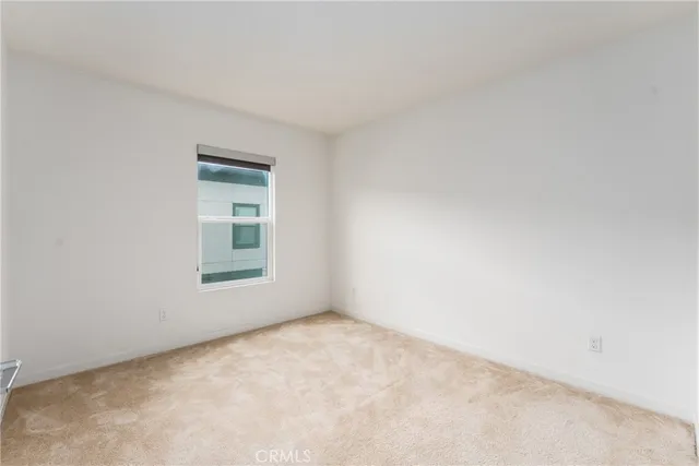 a view of a hallway with washer and dryer