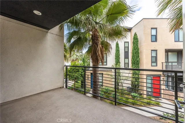 a view of a patio with table and chairs and potted plants