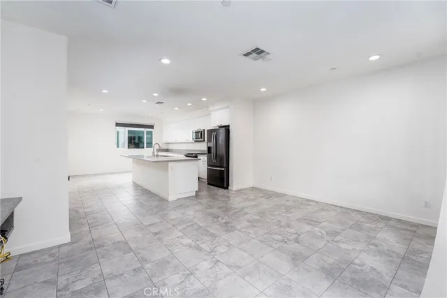 a view of a kitchen with a sink