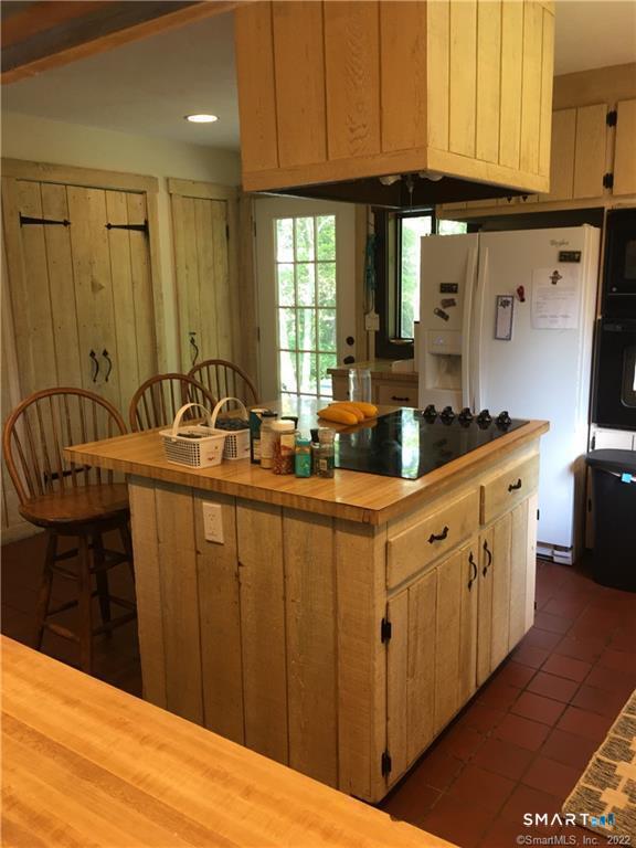 36 Lyons Plain Road Westport, CT 06880 - Photo 7 of 9 a kitchen with stainless steel appliances granite countertop a sink stove and cabinets