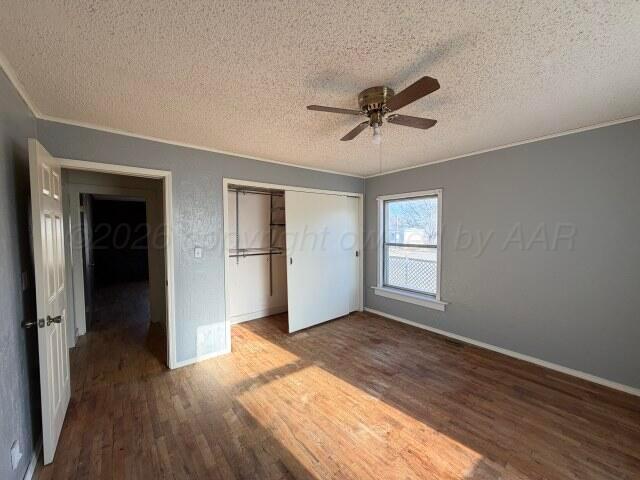 822 East Santa Fe Avenue Canadian, TX 79014 - Photo 15 of 19 a view of empty room with wooden floor and ceiling fan