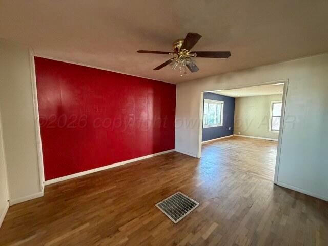 822 East Santa Fe Avenue Canadian, TX 79014 - Photo 8 of 19 a view of an empty room with a window