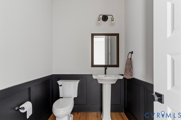 10512 River Road Chesterfield, VA 23838 - Photo 25 of 64 Pedestal sink with a dark bronze faucet, wood-fini