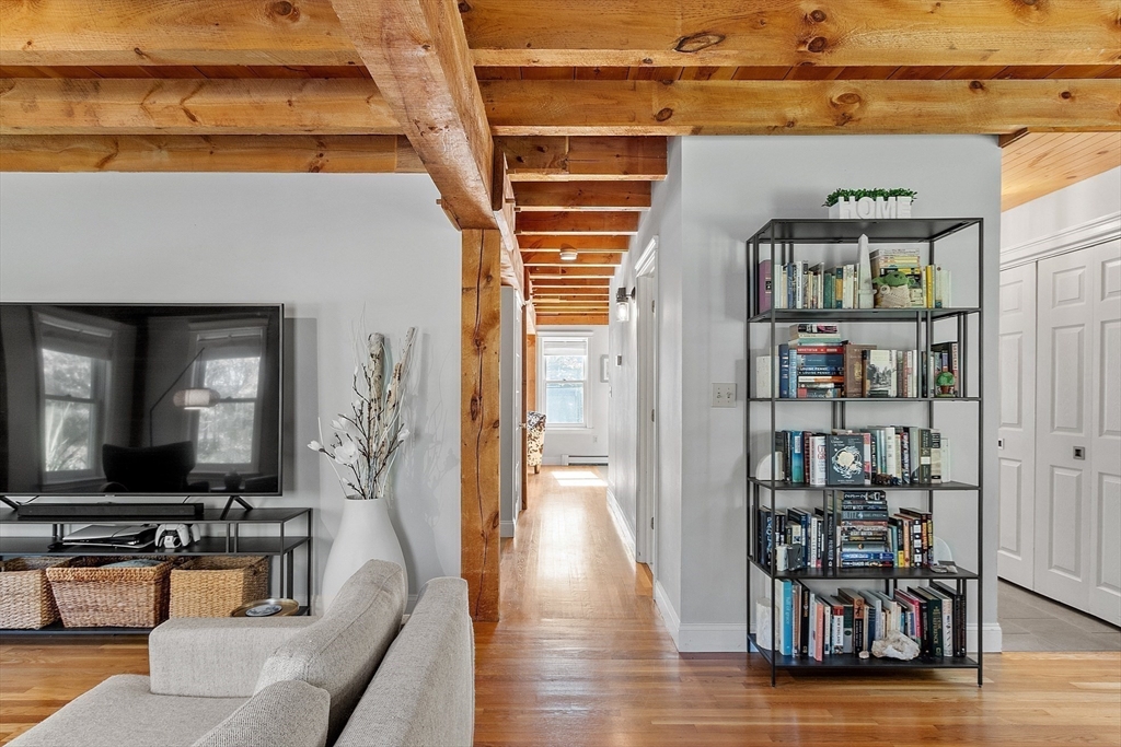 55 Carroll Road Grafton, MA 01536 - Photo 12 of 40 a living room with furniture and a flat screen tv