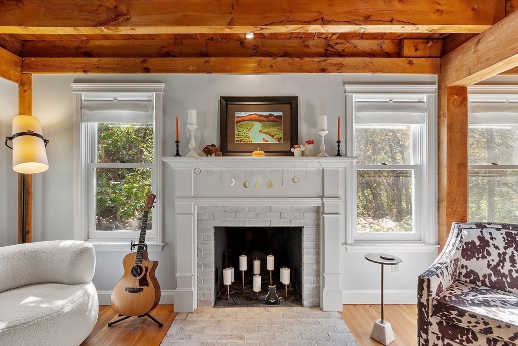 55 Carroll Road Grafton, MA 01536 - Photo 15 of 40 a living room with furniture and a fireplace