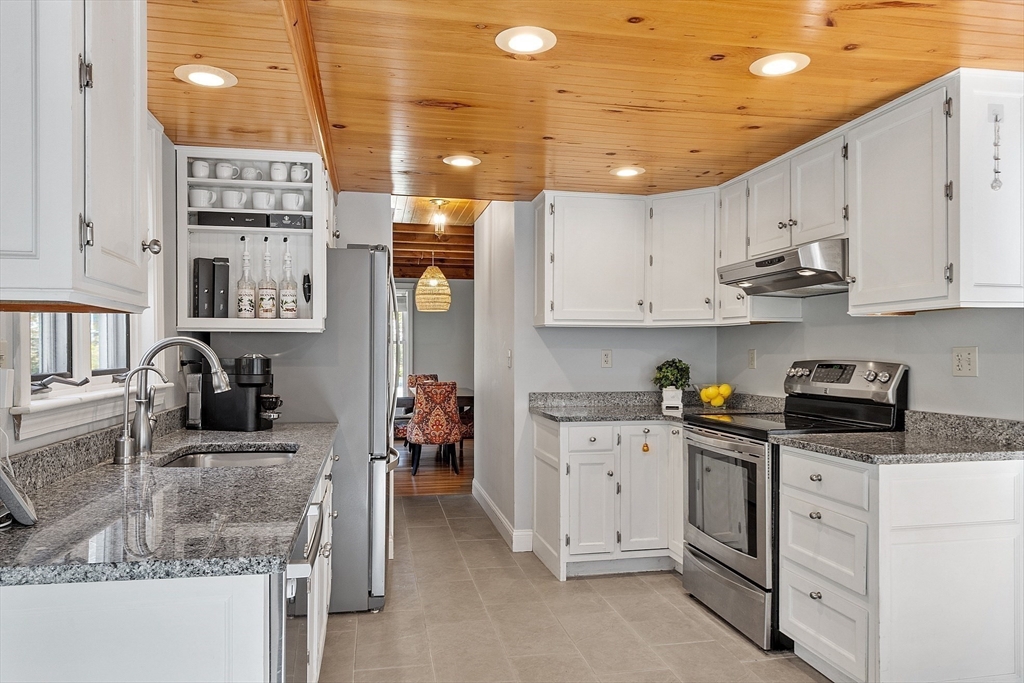 55 Carroll Road Grafton, MA 01536 - Photo 20 of 40 a kitchen with granite countertop a sink stainless steel appliances and cabinets