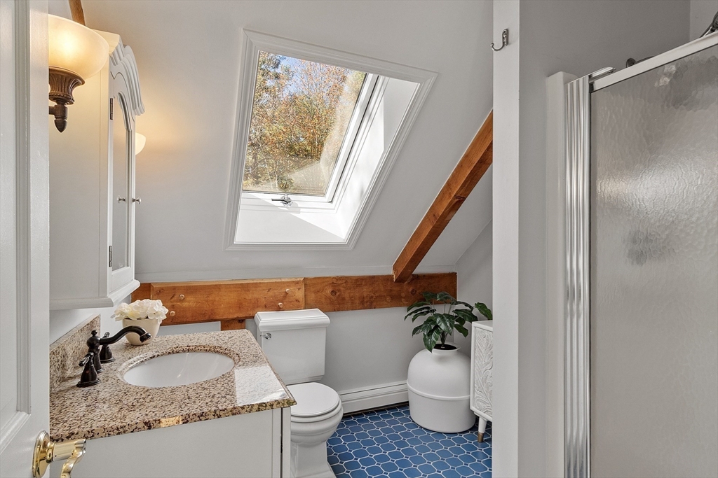 55 Carroll Road Grafton, MA 01536 - Photo 23 of 40 a bathroom with a granite countertop sink and a mirror