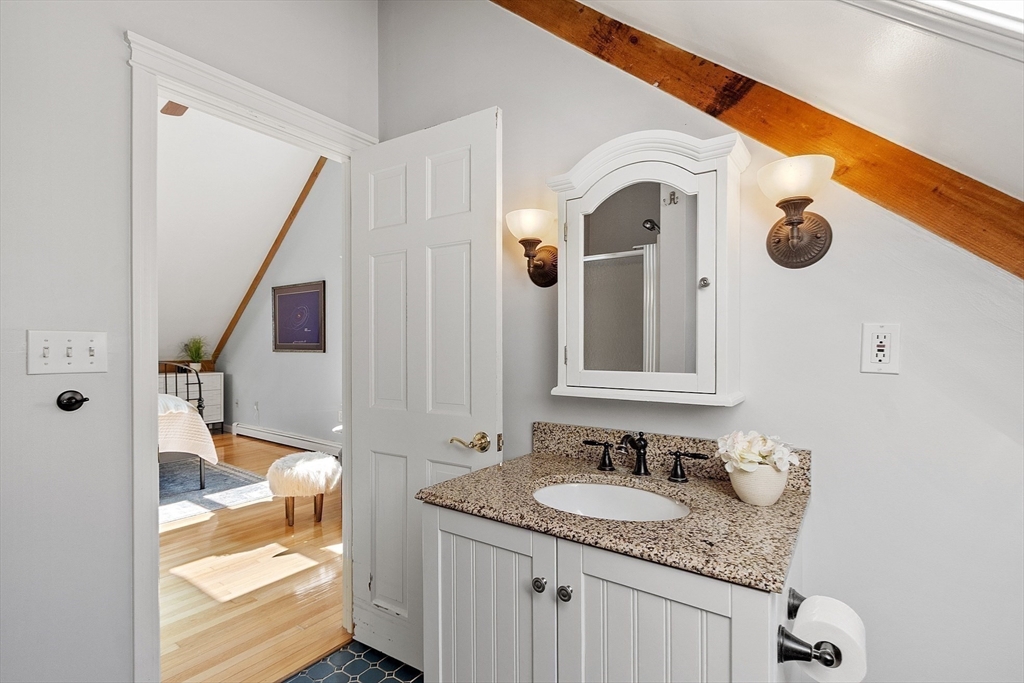 55 Carroll Road Grafton, MA 01536 - Photo 24 of 40 a bathroom with a granite countertop sink and a mirror