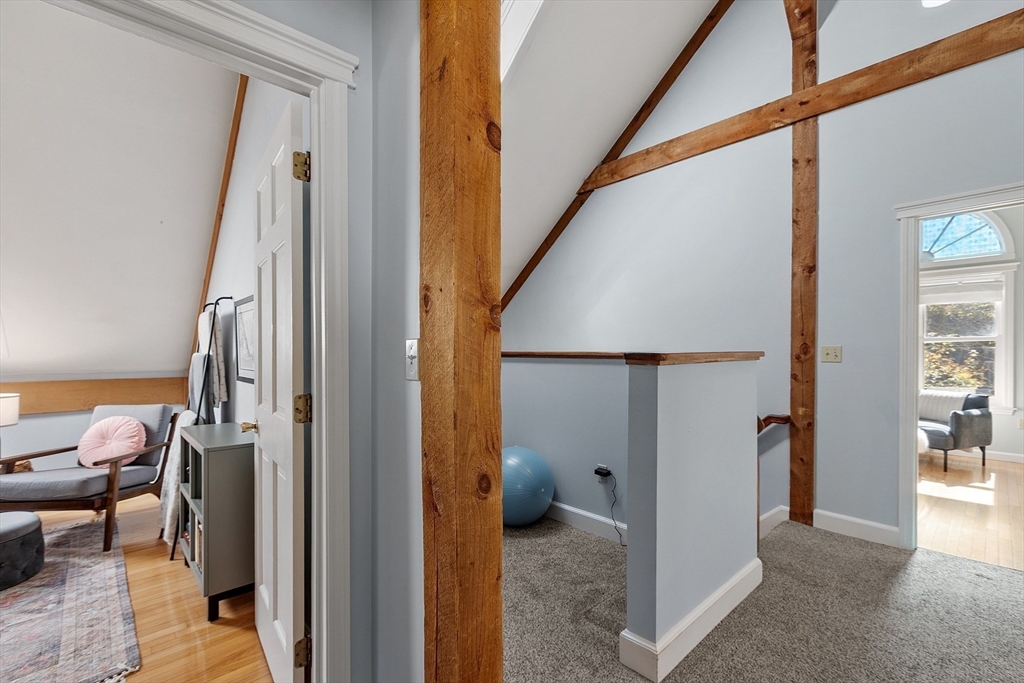 55 Carroll Road Grafton, MA 01536 - Photo 25 of 40 a view of a hallway and a livingroom with furniture